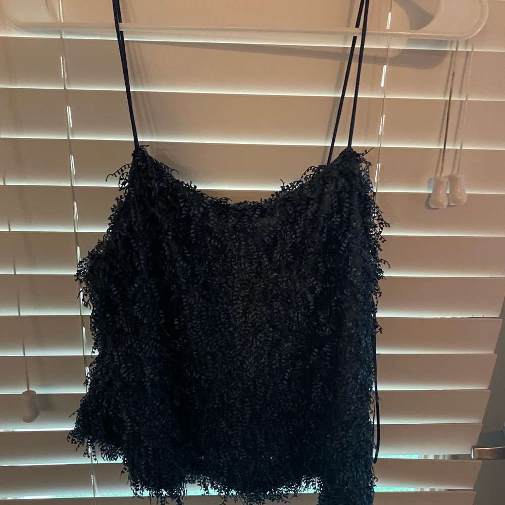 Dark blue fringe top with spaghetti straps
New with tags 
Never worn